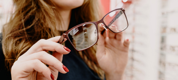 woman holding glasses