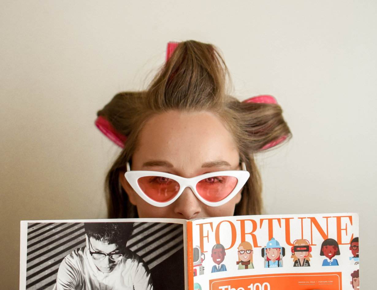 woman wearing cat eye tinted glasses